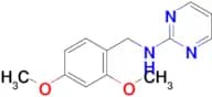 N-[(2,4-dimethoxyphenyl)methyl]pyrimidin-2-amine