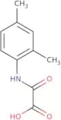 [(2,4-Dimethylphenyl)amino](oxo)acetic acid