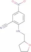 5-Nitro-2-[(tetrahydrofuran-2-ylmethyl)amino]benzonitrile